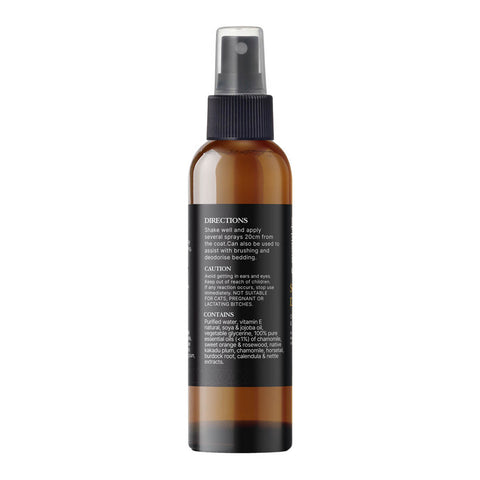 Brown spray bottle with black label on a white background.