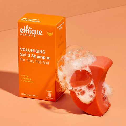 Ethique Volumising Solid Shampoo for Fine, Flat Hair 110g box with foaming orange bar.