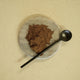 Evolution Botanicals Himalayan Shilajit powder with a spoon. Fine texture and brown colour.
