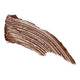 Swatch of brown Eye of Horus Goddess Mascara, a gentle, long-wear, and water-resistant formula that coats lashes without clumping. Infused with moringa oil to promote lash health, and enriched with carnauba, candelilla, rice bran wax, and cera alba to nourish and set the formula for a long-wear, smudge-proof finish. Packaged responsibly in post-consumer resin.