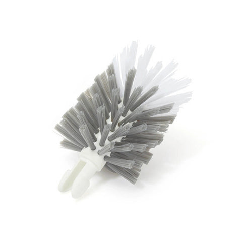 A small cleaning brush with gray bristles and a white plastic handle, photographed on a clean white background.