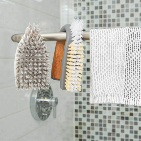 Lifestyle image of grunge buster hanging on towel rail in bathroom.