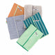 Full Circle Renew Essentials Microfibre Cloths 5 pack close up of a stack of folded blue, green and grey striped cloths, clear product photo
