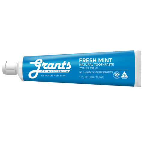 Grants Fresh Mint Natural Toothpaste Fluoride Free, a blue tube lying on its side, front view of the tube on a plain white background