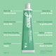 Green tube of Grants toothpaste with text on a green background.