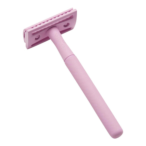 Pink safety razor on a white background.