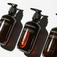 Three bottles of Grown Alchemist products on a white background
