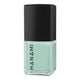 Mint green nail polish bottle with black cap on a white background
