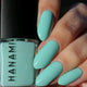 Mint green nail polish with 'HANAMI' branding and matching nails.