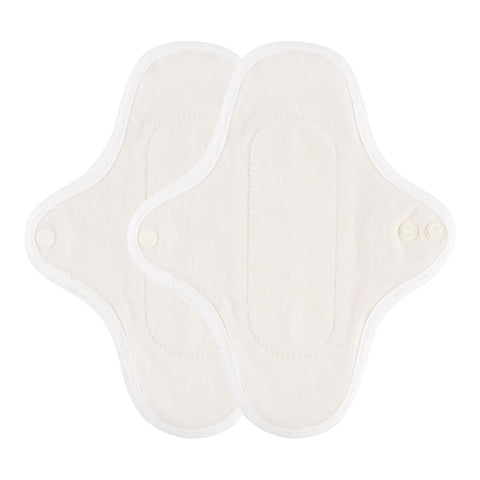 Inside view of a hannahPAD reusable pantyliner made from certified organic cotton, featuring double snap fasteners and silicone grips to prevent slippage.