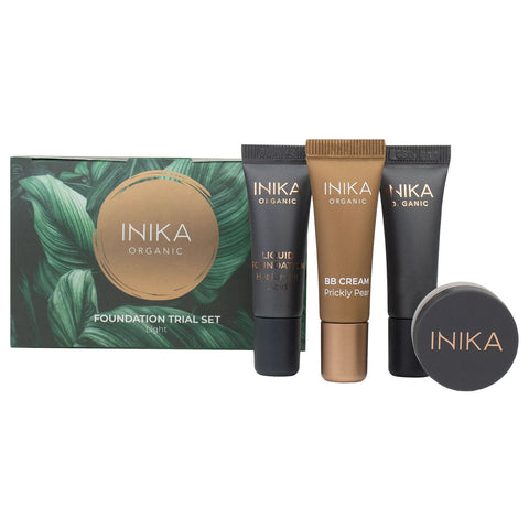 INIKA Organic foundation trial set including BB cream, primer, foundation & loose mineral foundation. Black & gold packaging on a white background. Shade - light.