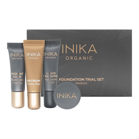 INIKA Organic foundation trial set including BB cream, primer, foundation & loose mineral foundation. Black & gold packaging on a white background. Shade - medium.
