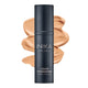 Bottle of INIKA Organic Liquid Foundation with a honey-coloured swatch behind it.