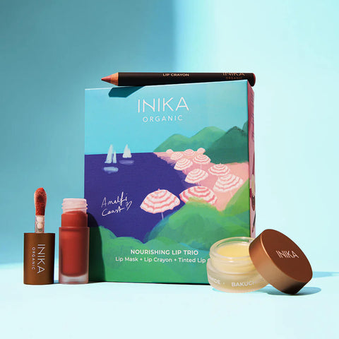 INika Organic lip care products on a blue background.