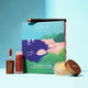 INika Organic lip care products on a blue background.