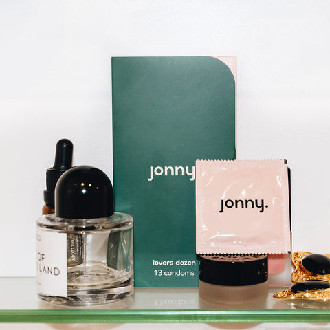 Jonny Lovers Dozen 13 Pack of vegan condoms with other beauty and personal care products.