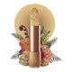Lip scrub set against a floral background. 