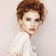 Young woman with fair, freckly skin tone & red hair wearing cordovan natural lipstick.