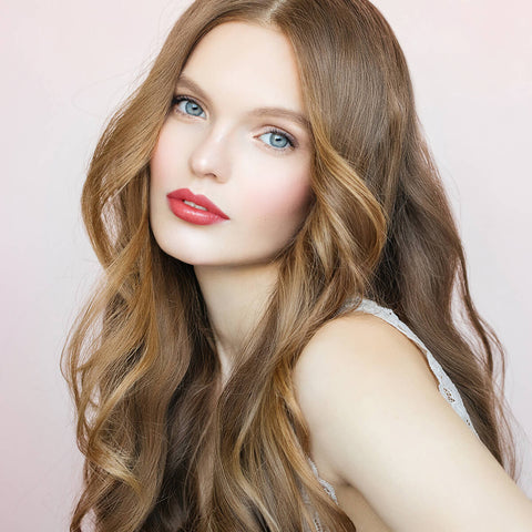Young woman with fair skin tone & blonde hair wearing violet mousse lipstick.