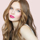 Young woman with fair skin tone & long blonde hair, wearing fuchsia shock lipstick.