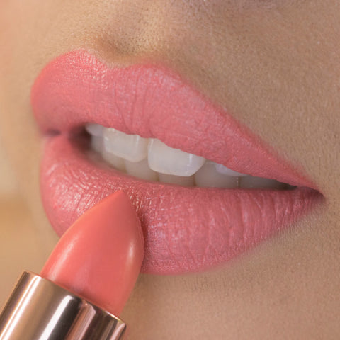 Close-up of peony petal lipstick applied on the lips. 