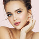 Young woman with light skin tone & brunette hair, wearing blushing rose lipstick.