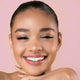 Young woman with light tan skin tone & dark hair wearing blushing rose lipstick.