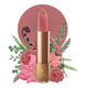 Lipstick detailed with KM initials & flower on the tip, set against a floral background. 