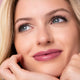 Young woman with light skin tone & blonde hair, wearing driven lipstick.