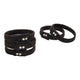 Set of black wristbands with silver buttons on a white background