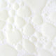 Swatch of milky mushroom gentle cleansing oil, thin bubbly 'milky' looking formula. 