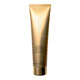 Kora Organics Turmeric Brightening & Exfoliating Scrub & Mask 100ml golden tube on a white background.