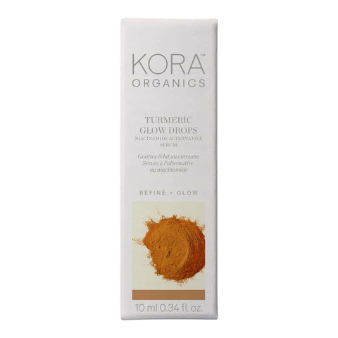Box of KORA Organics Turmeric Glow Drops. White packaging with powdered turmeric pictured. Refine + glow.