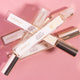Lavanila The Healthy Fragrance Pure Vanilla 10ml lifestyle shot of several roller bottles lying across a pink backdrop, styled lifestyle photo