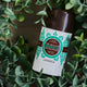 Lavanila The Healthy Probiotic Deodorant Vanilla Eucalyptus 57g lifestyle shot of the stick lying among green eucalyptus leaves