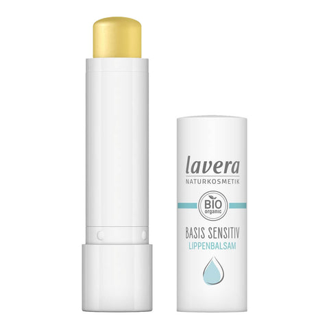 Lavera Basis Sensitiv Lip Balm 4.5g open stick showing the pale balm, with its white cap beside it on a plain white background