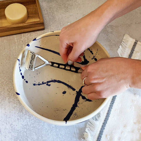 Person putting on a grip sleeve over a bowl
