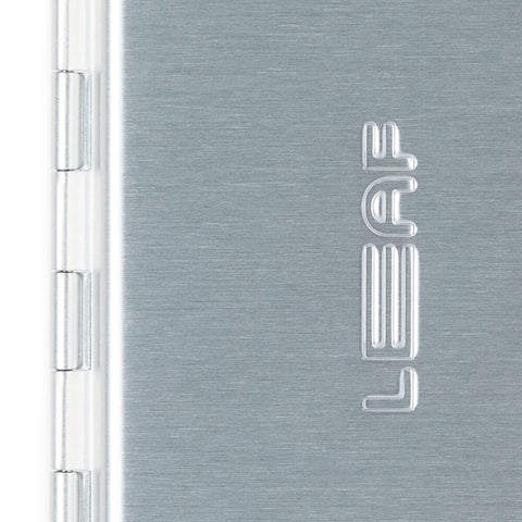 Leaf Shave Single Edge Travel Case close up of the side of the case showing the hinge and the Leaf lettering, clear product photo