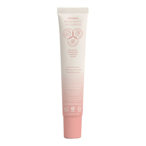 Back of tube of watermelon lip balm, showing icons and pink text on a gradient.