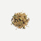 Love Tea Kapha Loose Leaf Tea leaves, Ayurvedic herbal blend with ginseng, turmeric, ginger, and cinnamon.