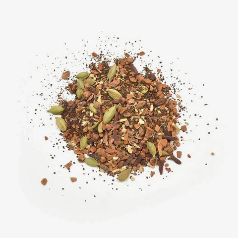 Love Tea Original Chai Loose Leaf Tea 100g, a small pile of spices and tea leaves, overhead on a plain white background, clear product photo