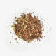Love Tea Original Chai Loose Leaf Tea 100g, a small pile of spices and tea leaves, overhead on a plain white background, clear product photo