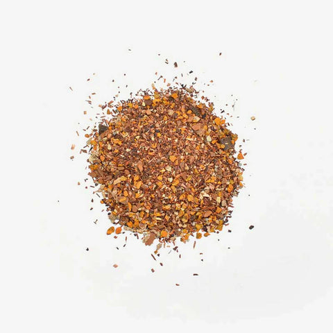 Love Tea Turmeric Tea Loose Leaf Tea 100g, a small pile of dried orange brown herbs, overhead on a plain white background, clear product photo