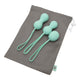 Kegel set laying on top of a drawstring pouch.