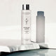 Madara Micellar Water lifestyle shot of the bottle on a white stone slab with a soft shadow beside it, styled lifestyle photo