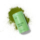 Morning Made Matcha Latte Vanilla Blend lifestyle shot of the tin lying in a spill of green matcha powder on a plain white background