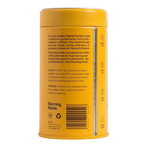 Morning Made Turmeric Latte Original Blend 300g yellow tin turned to show the back with small print and a barcode on a plain white background