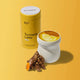 Morning Made Turmeric Latte Original Blend 300g lifestyle shot of the yellow tin beside a mug of golden latte and turmeric roots