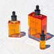 100ml, 30ml, and 5ml glass dropper bottles of Mud Organics Sea Buckthorn Serum, a hydrating and nourishing formula that improves the aging process, repairs sun damaged skin, and helps diminish hyperpigmentation.