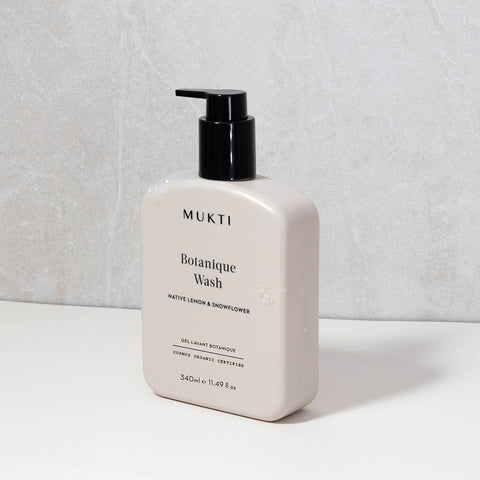 Mukti Botanique Wash bottle on a light gray background